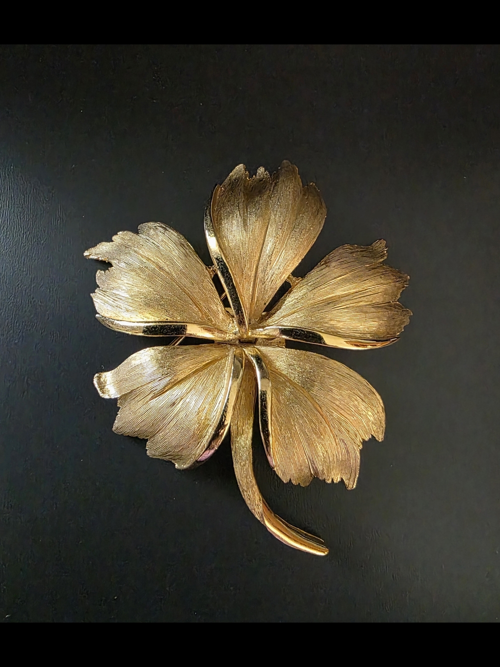 Vintage Crown Trifari gold-tone flower brooch